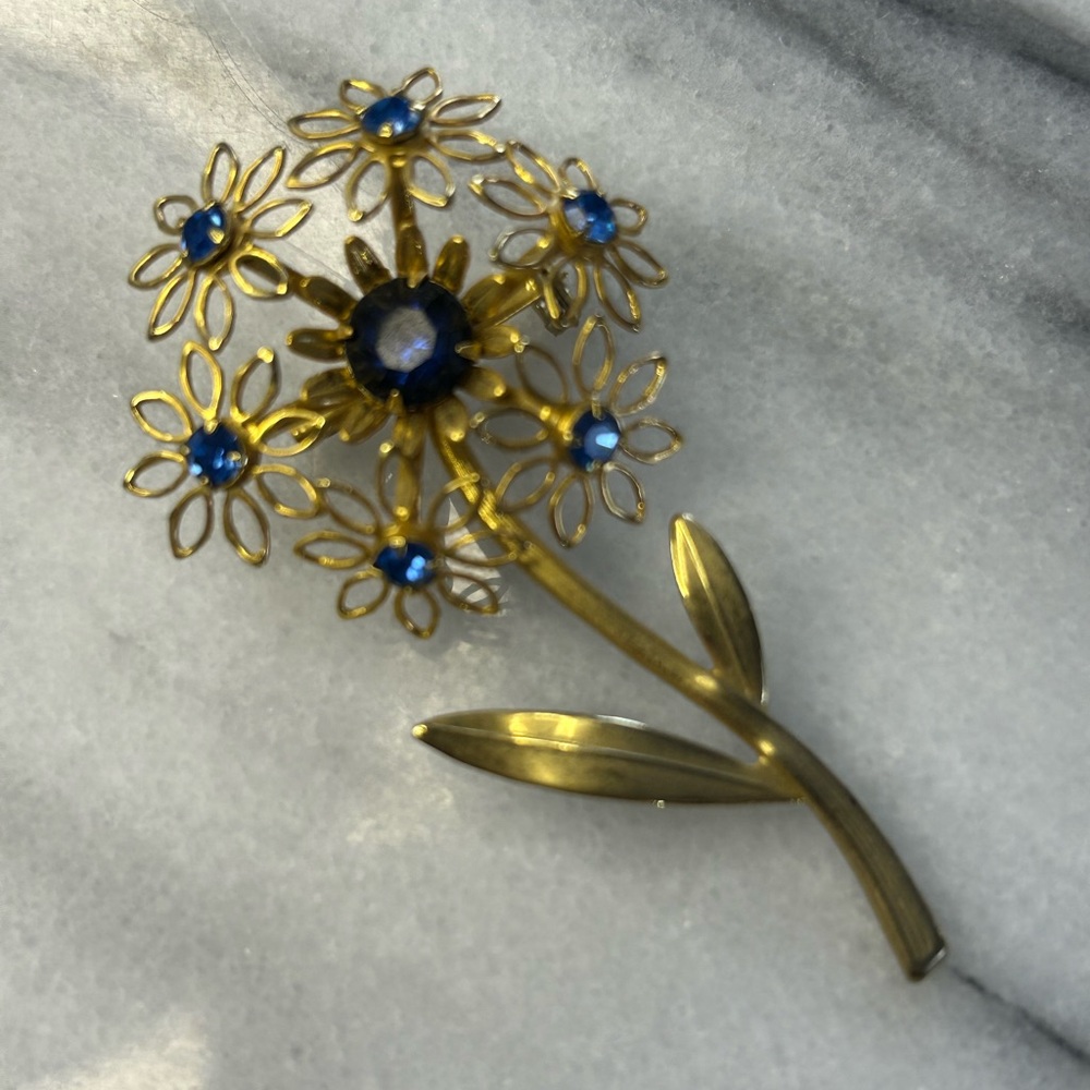 Gold Tone Floral Brooch with Blue Accents